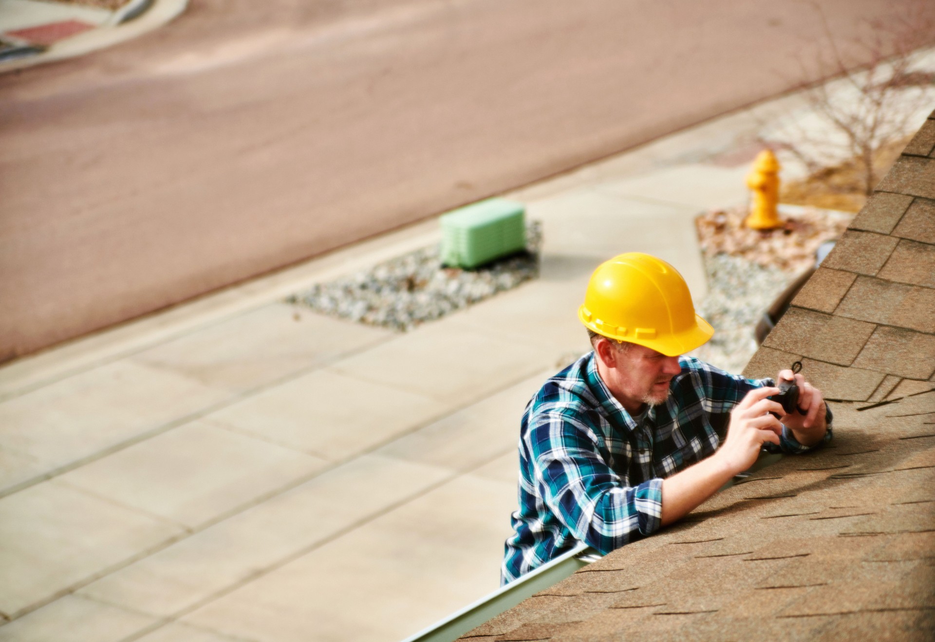 nspector assessing a residential roof in Tampa, FL.